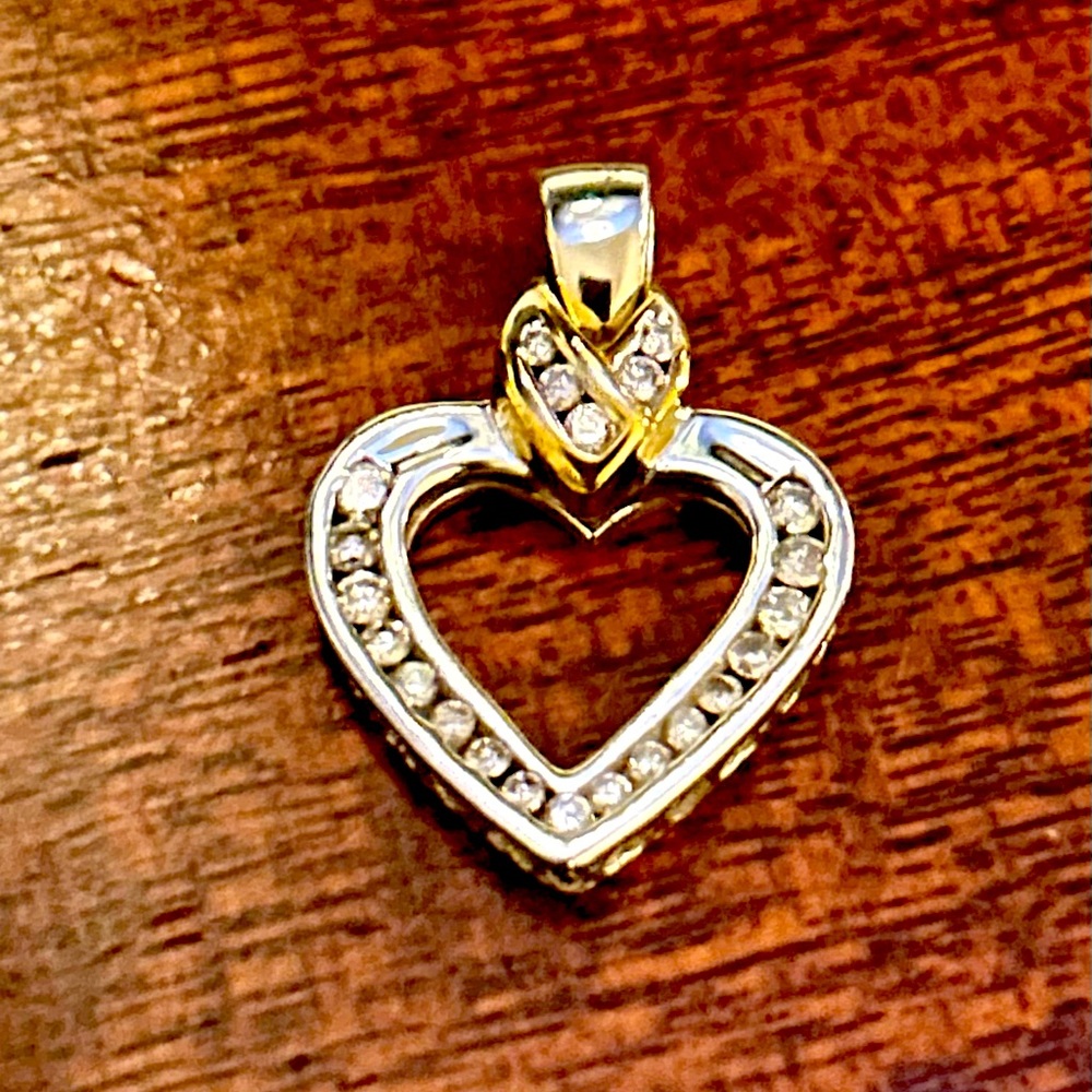 10 karat white/yellow gold heart, diamond pendant .70 carats.